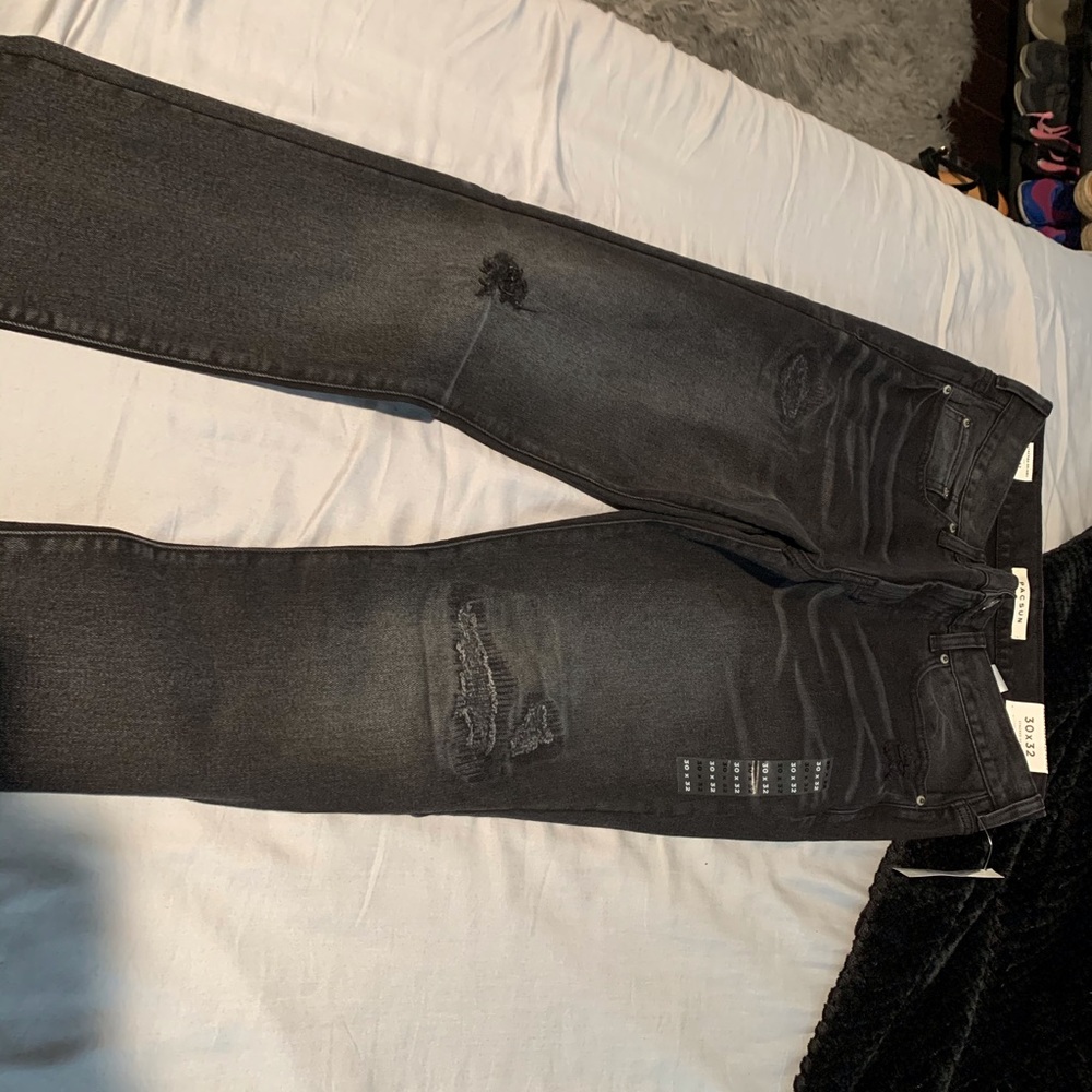 Black/ grayish ripped jeans